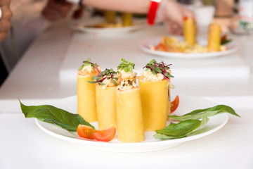 appetizer - cheese rolls with meat and vegetables