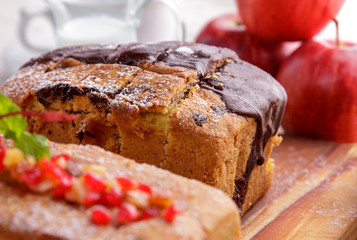 homemade soft sponge cake with cherry and chocolate topping
