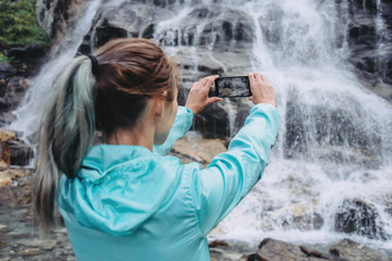 Traveler photographing with smartphone