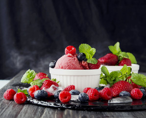 fruit ice cream with fresh strawberries, blueberries and raspberries