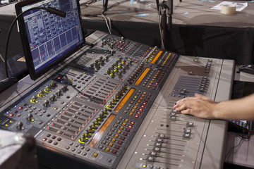 sound studio adjusting record equipment.