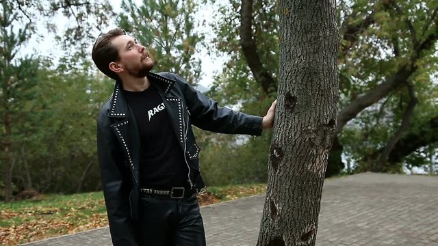 Handsome bearded man in black leather jackets