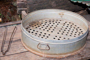 Old steamer pot on the stove in table