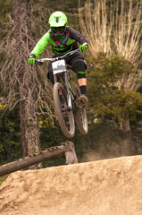 Fototapeta premium Extreme jump on a bike in forest