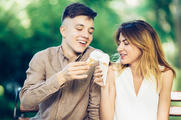 man and woman sitting eating ice cream