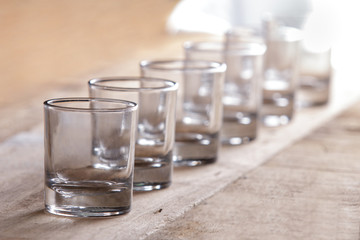 a group of shot glasses in a row