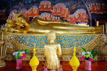 Beautiful of golden Buddha statue and thai art architecture in Wat Bovoranives, Bangkok, Thailand.