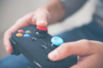 Man playing and holding joystick © Viacheslav Yakobchuk