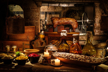 Medieval ancient kitchen tabe with typical food in royal castle