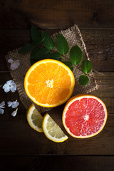 Citrus set. Oranges, lemons and grapefruit on a wooden table. Top view. Flat lay.