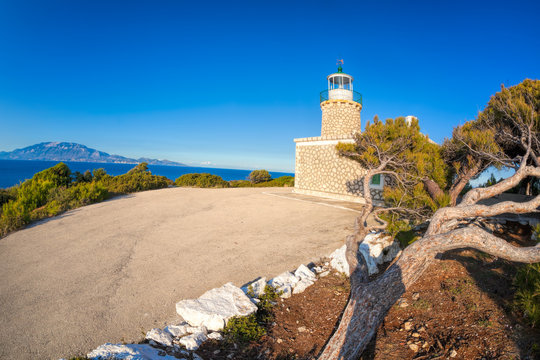 Skinari Lighthouse against Kefalonia island on Zakynthos island, Greece