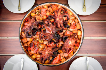 Preparing and Cooking of octopus in traditional Croatian peka Sa © _jure