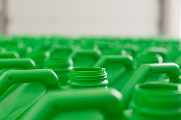 Obraz premium Empty plastic cans green color.