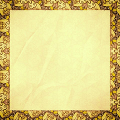 The crumpled form lies on yellow wall-paper, with an abstract sp