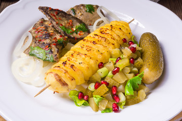 fried liver with fried potato and salt cucumbers