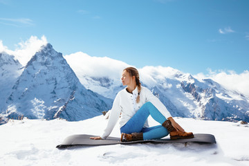 Yoga on mountain in winter