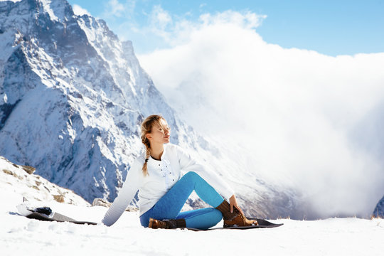 Yoga on mountain in winter