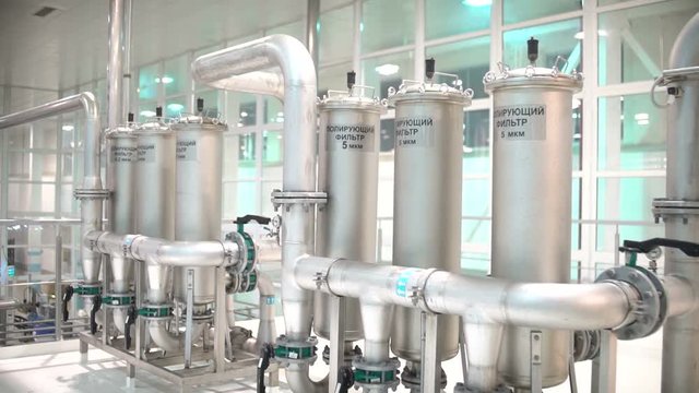 Water treatment plant. The Modern Automated Production Line. Factory of production. Production section. Manufacturing facility. Industrial production. Steel pipes for water supply in the workplace