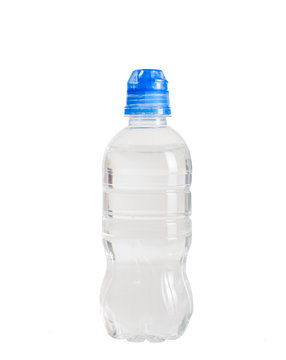 A bottle of water and a blue sports cap. On white, isolated background.