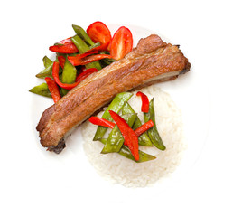 Roasted pork rib on the plate isolated on white background with clipping path