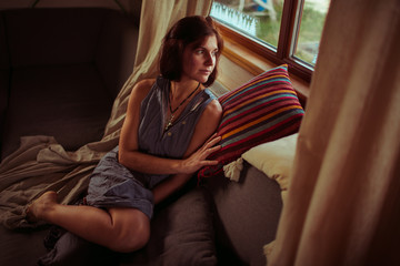 Fototapeta premium Sad girl look in the window