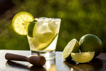Lemon Fruit Caipirinha of Brazil on green blurry background © paulovilela