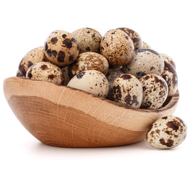 quail eggs in wooden bowl isolated on white background cutout