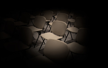 Empty Chairs in convention hall and black around background