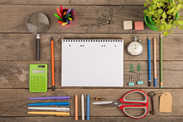 Back to school concept - school supplies on the wooden desk