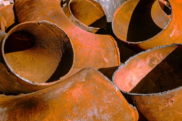 Large pieces of metal bent tubes closeup outdoors