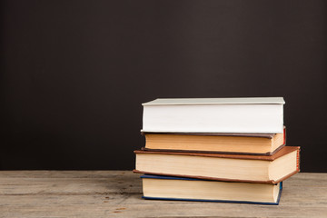 School books on desk, education concept