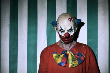 scary evil clown in the circus