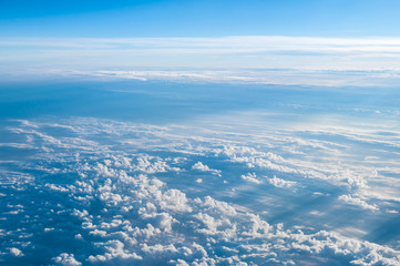 Aerial view above clouds from airplane with copy space for background design