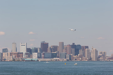 Fototapeta na wymiar Plane over the Boston Skyline