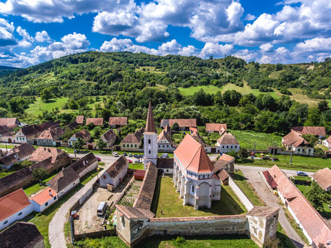 The fortified church Cloasterf. Traditional saxon village in Transylvania, Romania. Aerial view from a drone. HDR image.