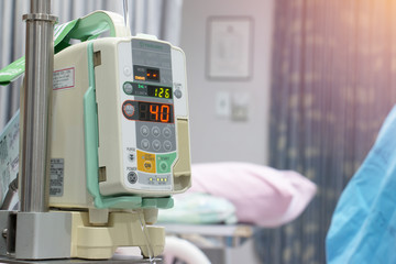 IV machine while patient lying on bed in hospital