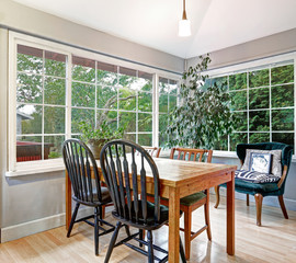 Cozy summer room with dining table set