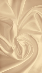 Smooth elegant golden silk as wedding background. In Sepia toned