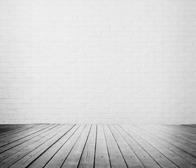 room interior with wooden floor and cement brick wall