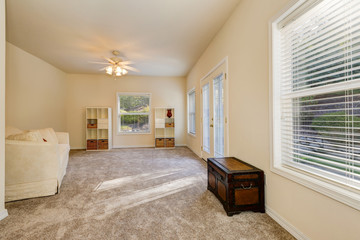 Sunny spacious sitting room interior with exit to the back yard