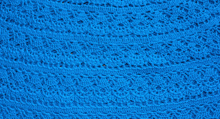 Background image of knitted sweaters.