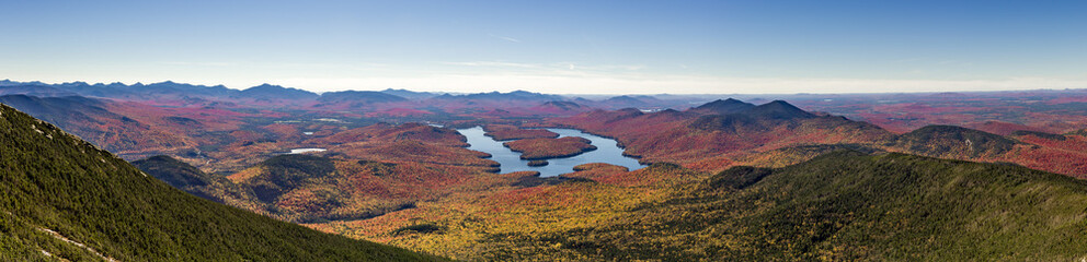 Panoramic view of the Adirondack Mountains featuring Lake Placid on a sunny autumn day as seen by...