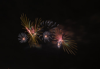 Fototapeta na wymiar fireworks against the dark night sky