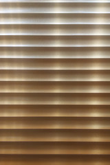 Obraz premium Closeup of wooden slats of a blind with natural sunshine shining