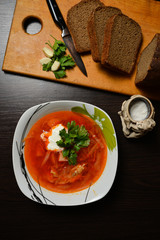 red soup with herbs bread garlic