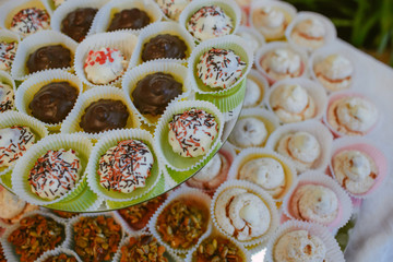 A look from above on the tired dish full of different cupcakes