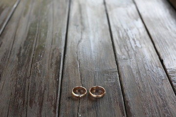 Delicate rings lie on the wooden porch
