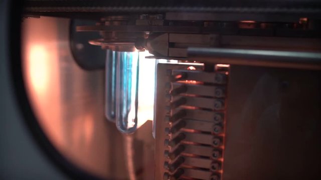 The preform of plastic bottles. Production of plastic packaging. Plant for the production of plastic containers. Machine blowing plastic bottles. A lot of blanks for plastic bottles.
