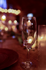 A picture of empty wineglass standing on the dinner table