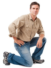Obraz premium Full-length construction worker building contractor carpenter serviceman kneeling isolated on white background
